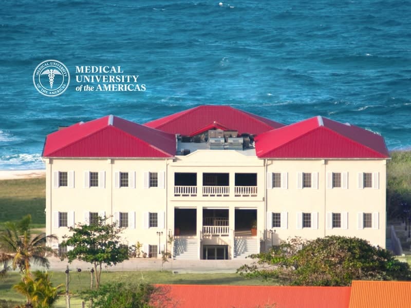 A view of the Medical University of the Caribbean, showcasing its modern architecture and vibrant campus environment