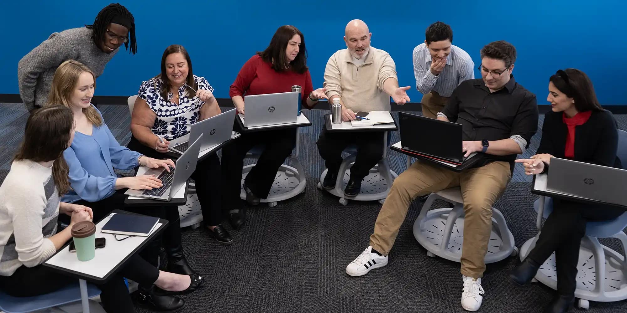 group of people discussing and chatting in classroom