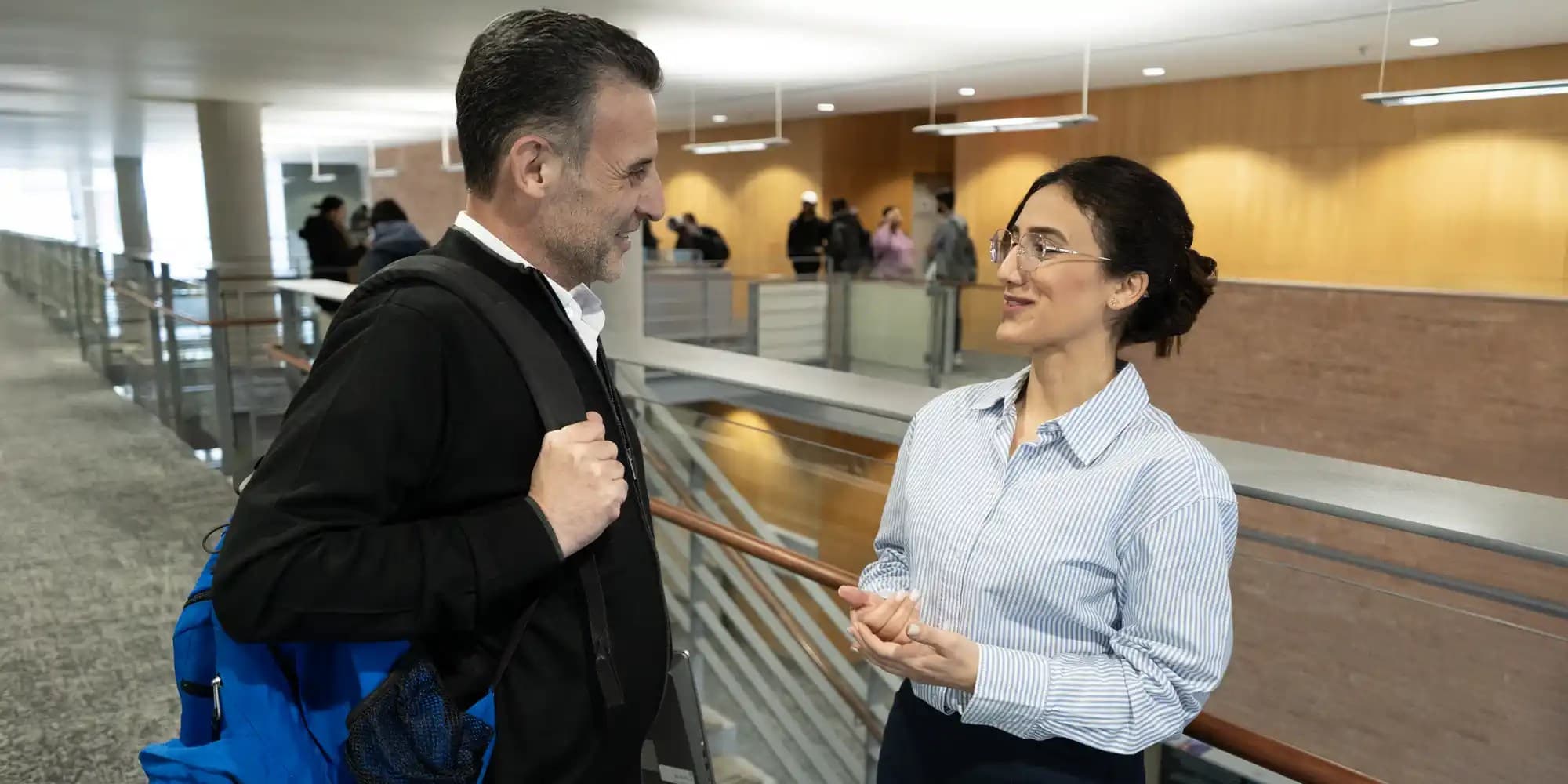 Faculty and student interacting in the campus