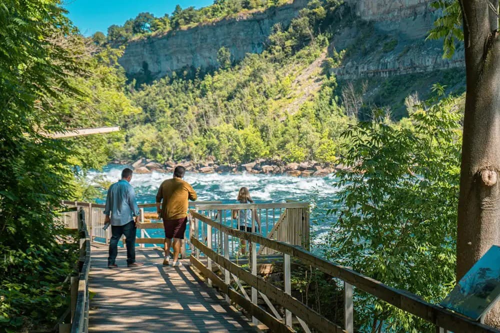 Few people seen walking on a patio at the peak summer season