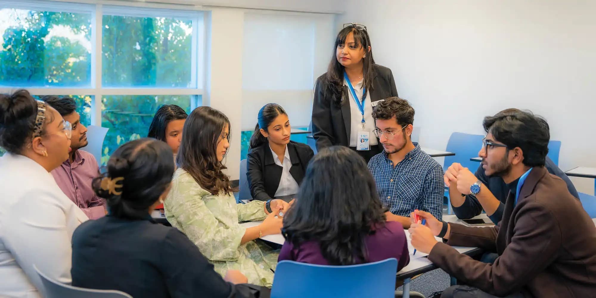 Students and faculty of Honours Bachelor of Business Administration discussing in class