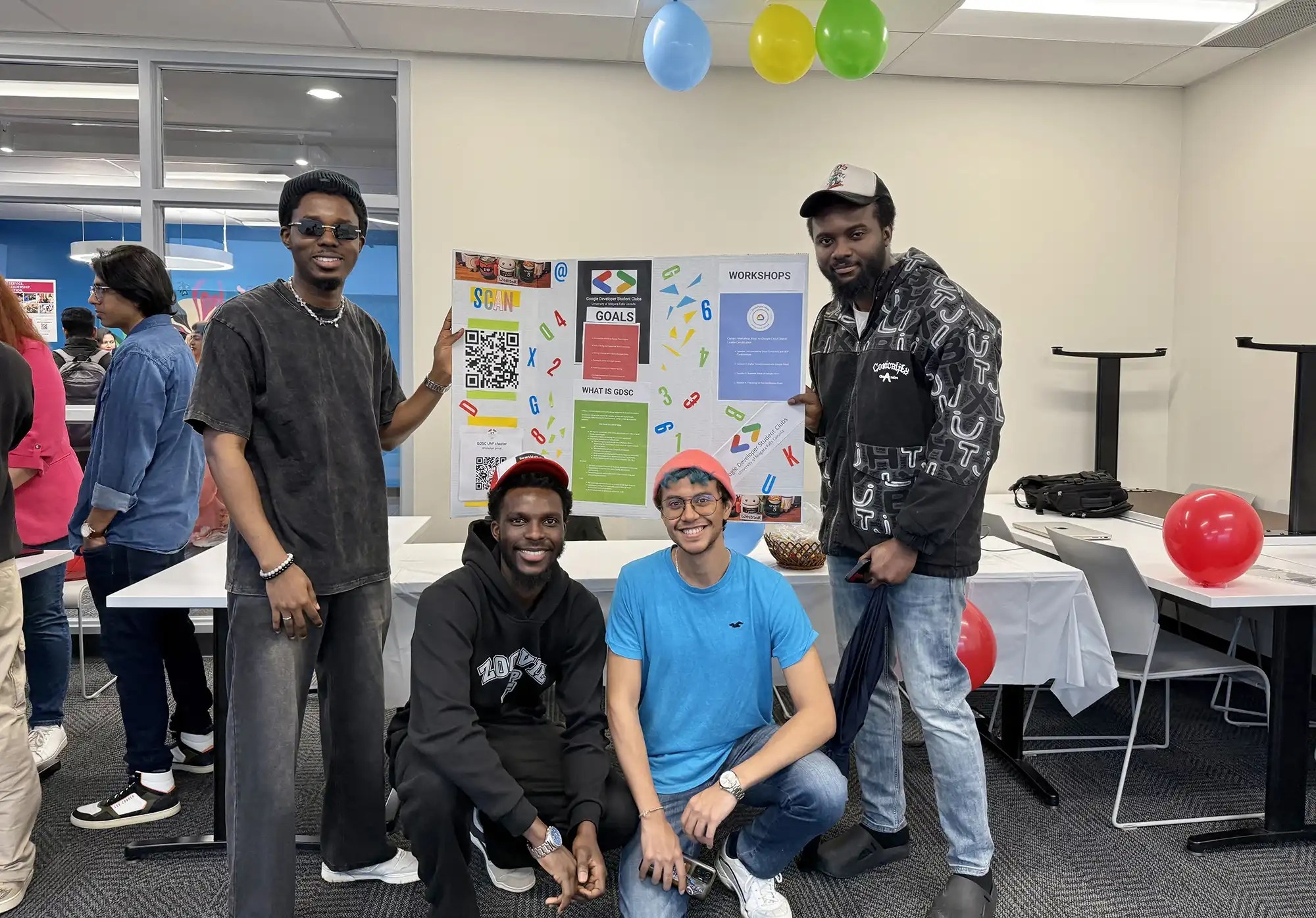 UNF students from Google Developer Students Club holding a presentation board