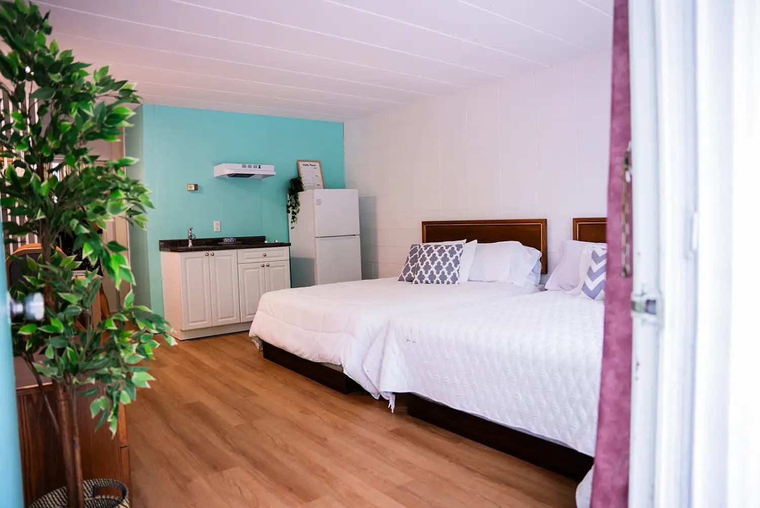 Student Residences room with two beds and kitchen area