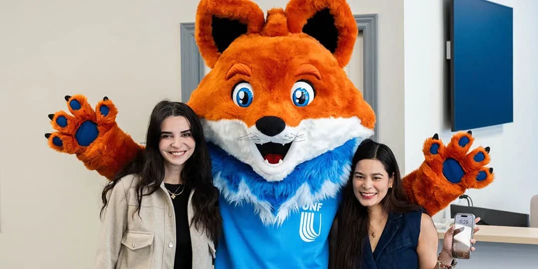 UNF students with the mascot Spark
