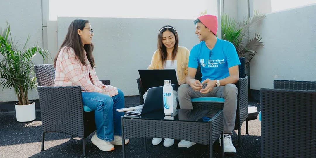 UNF students siting in the patio area