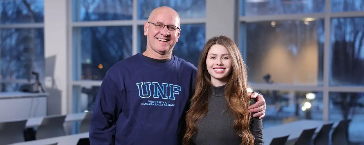 Making Their Mark: Father and daughter cross the stage together at Spring Convocation