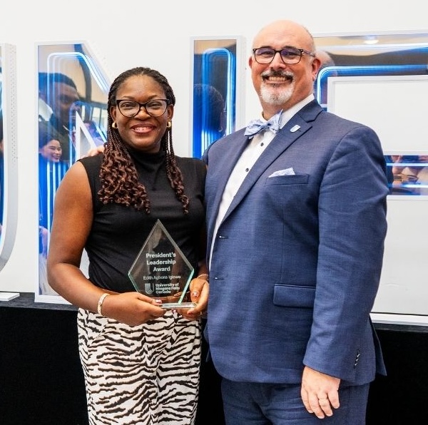 Student receiving leadership award.